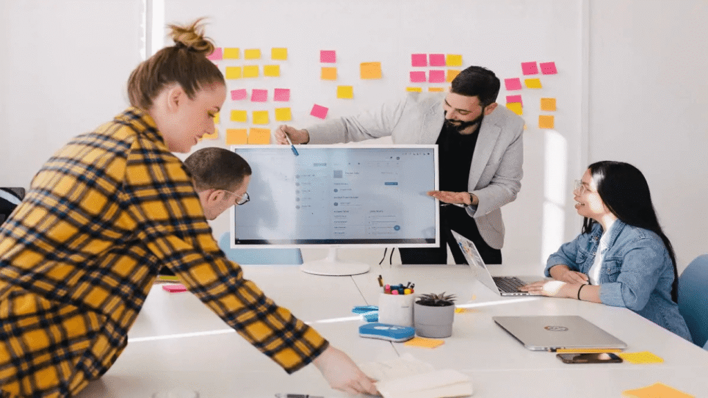 hr manager reviewing automated payroll and compliance reports